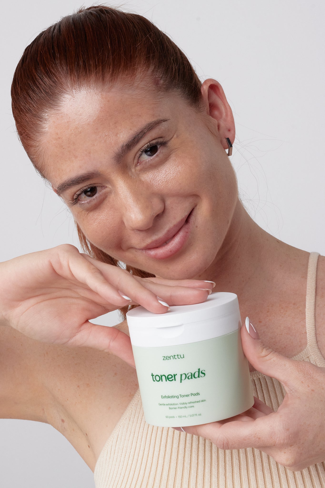 Woman holding skincare product